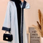 Light blue abaya embroidered with black guipure